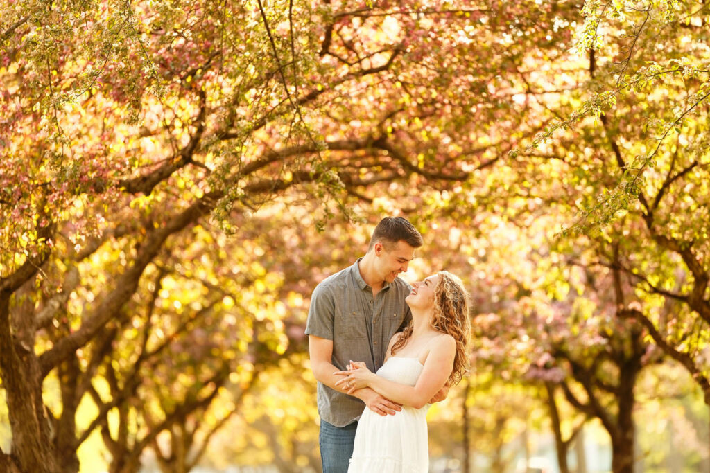 Photo engagement session at historic south east Neighbourhood blooming trees Rochester MN