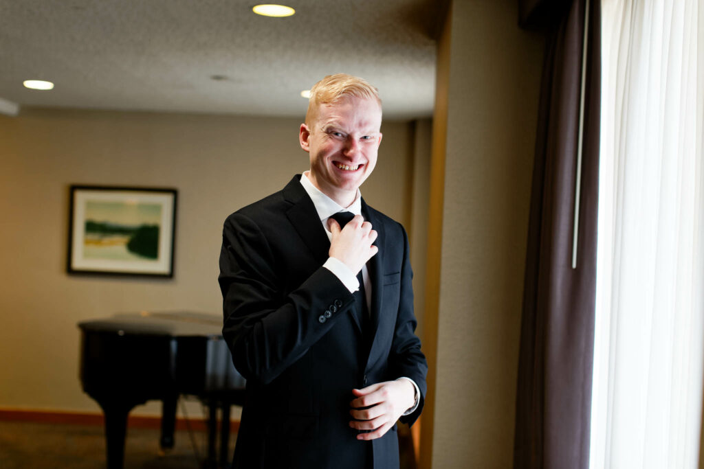 Groom fixing his tie Kahler Grand Hotel Rochester MN
