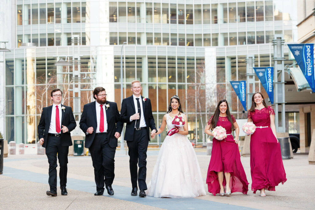 Wedding party walking on Peace Plazza