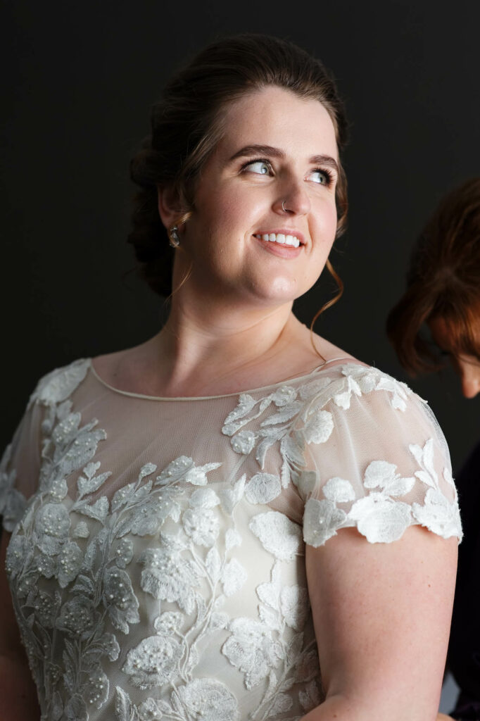Contrasted portrait of the bride on the black background