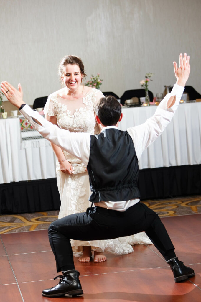 Crazy first dance of the bride and groom on the dance floor