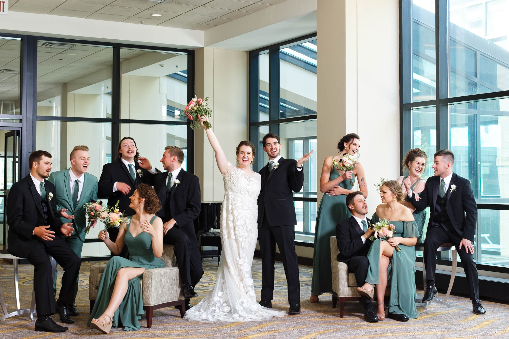 Funny posed picture of the entire wedding party in the Marriott lobby