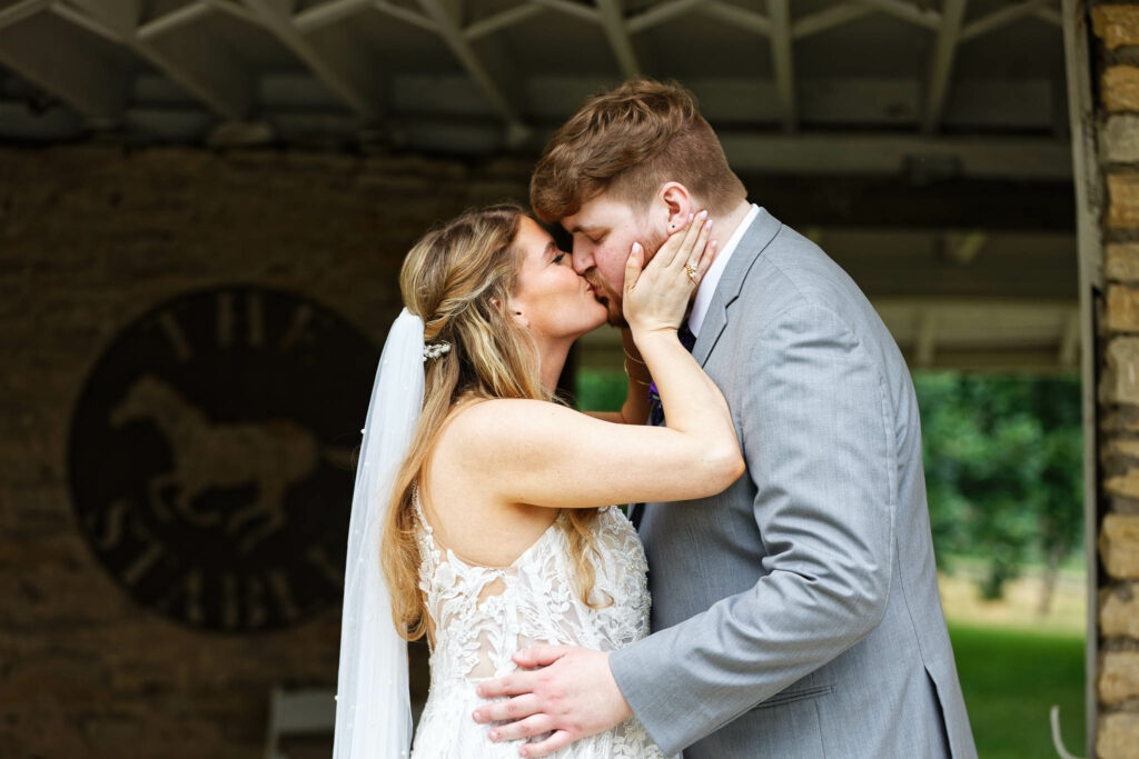 014-Bride and groom picture at Mayowood stone barn groom, kissing