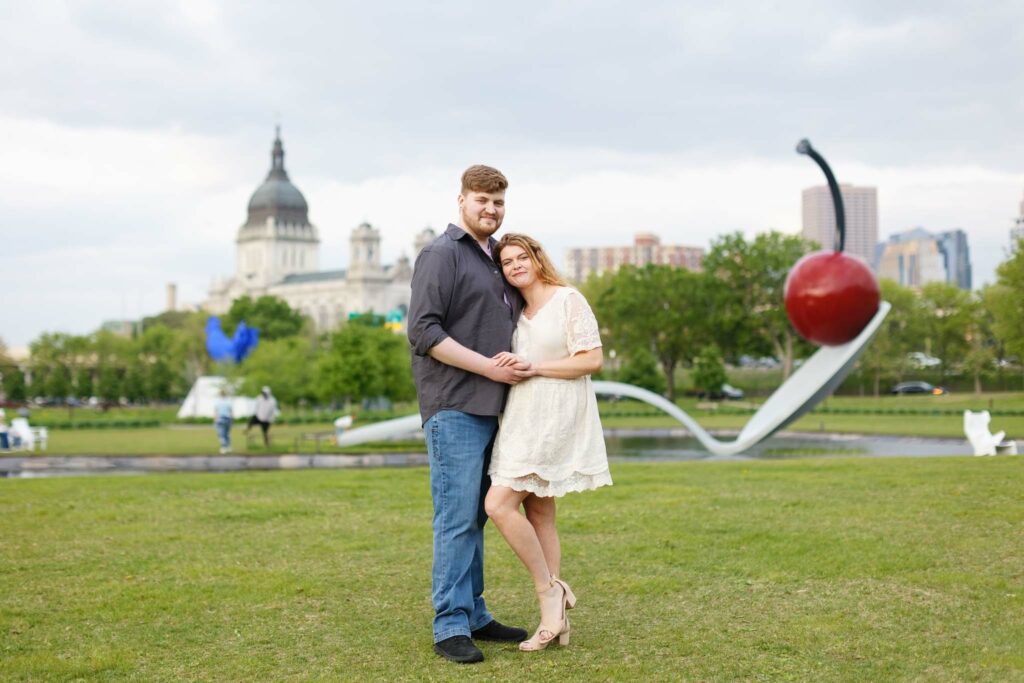 Engagement session in school to garden Minneapolis in front of the spoonBridge and Cherry