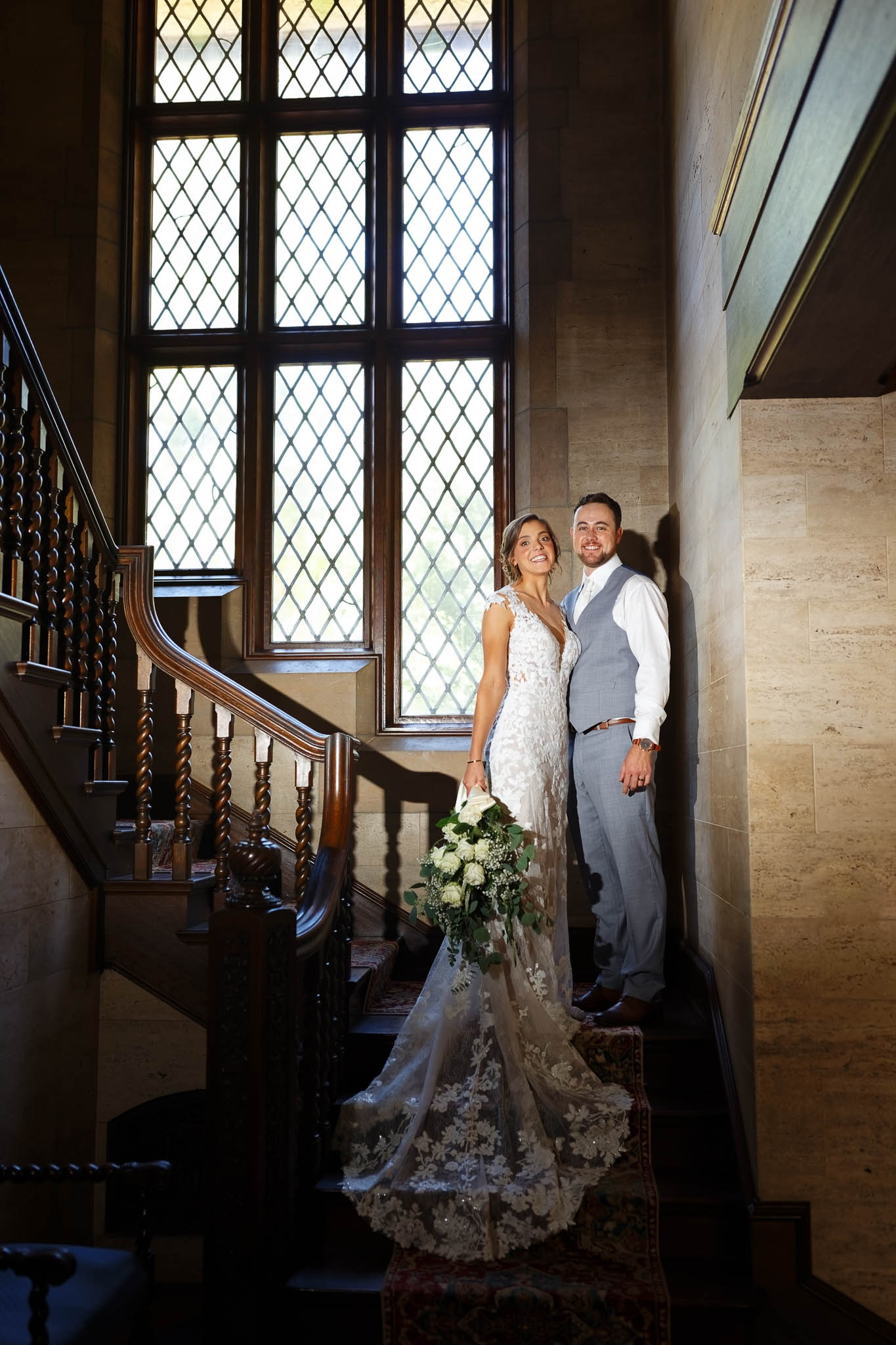 bride and groom at plummer house stairs-2