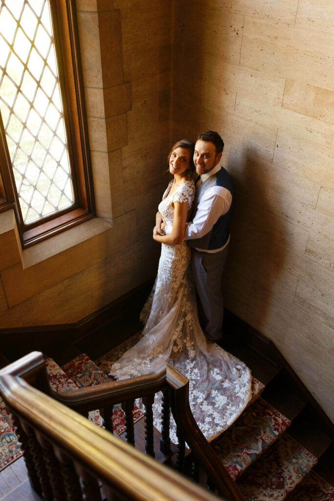 bride and groom at plummer house stairs