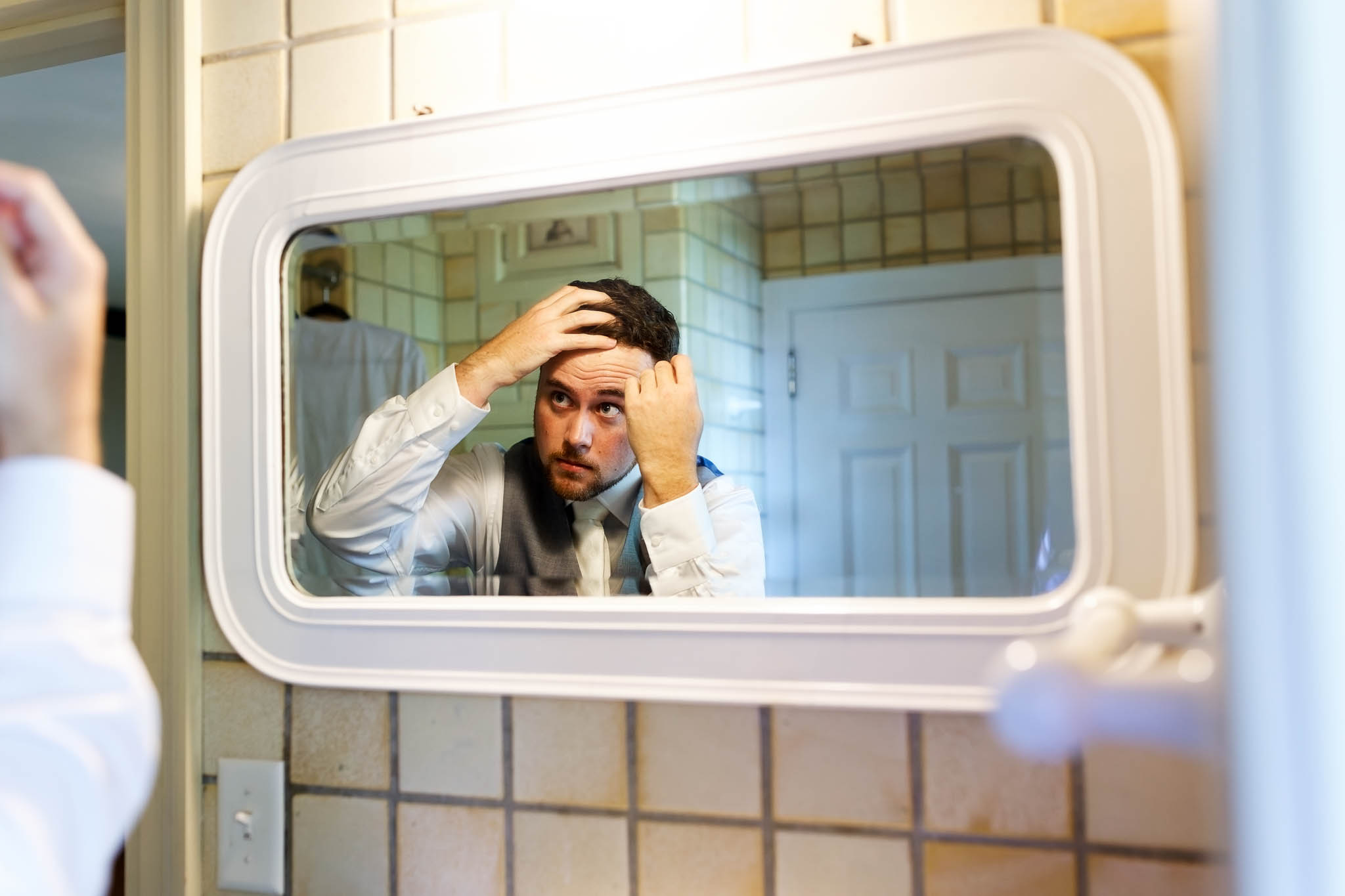 groom getting ready at the Plummer House