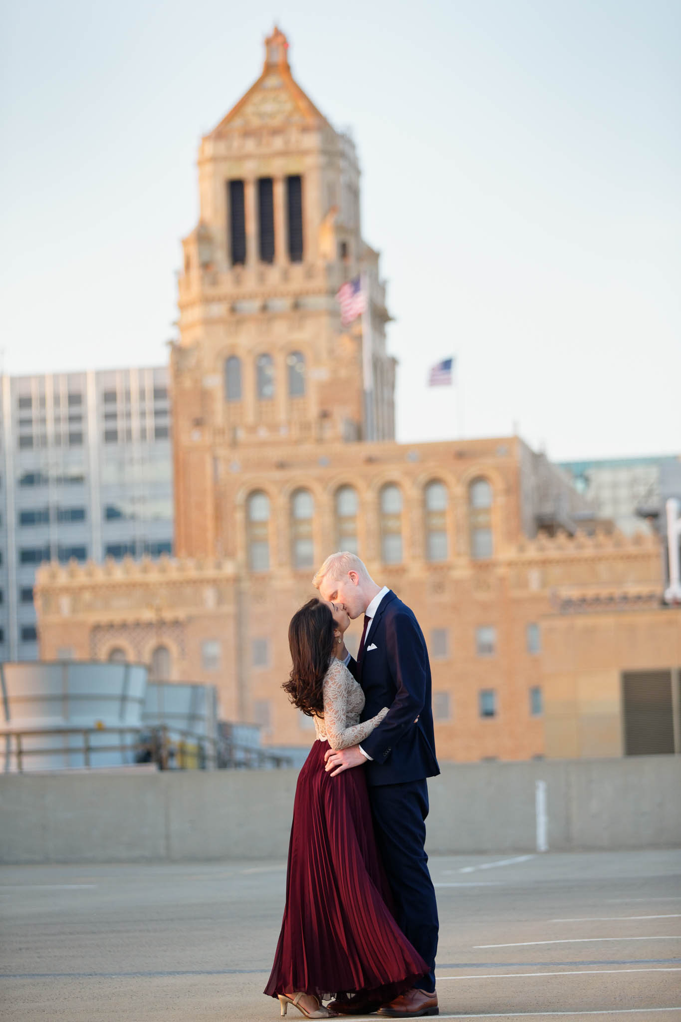 All couple on parking ramp, rooftop view and the plummer building Carillon