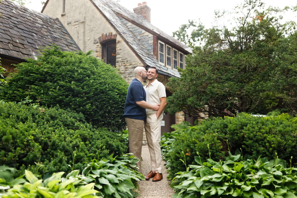 Couple portraits at Plummer House with evergreen plants