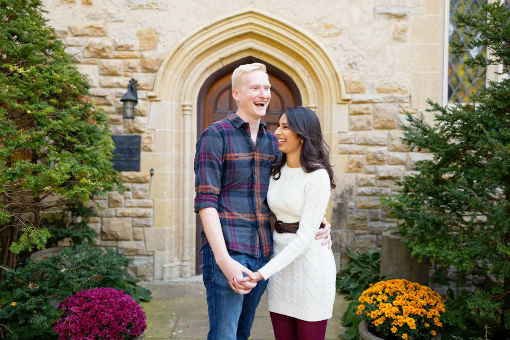 Engagement session at Plummer House in front of the gothic wood door