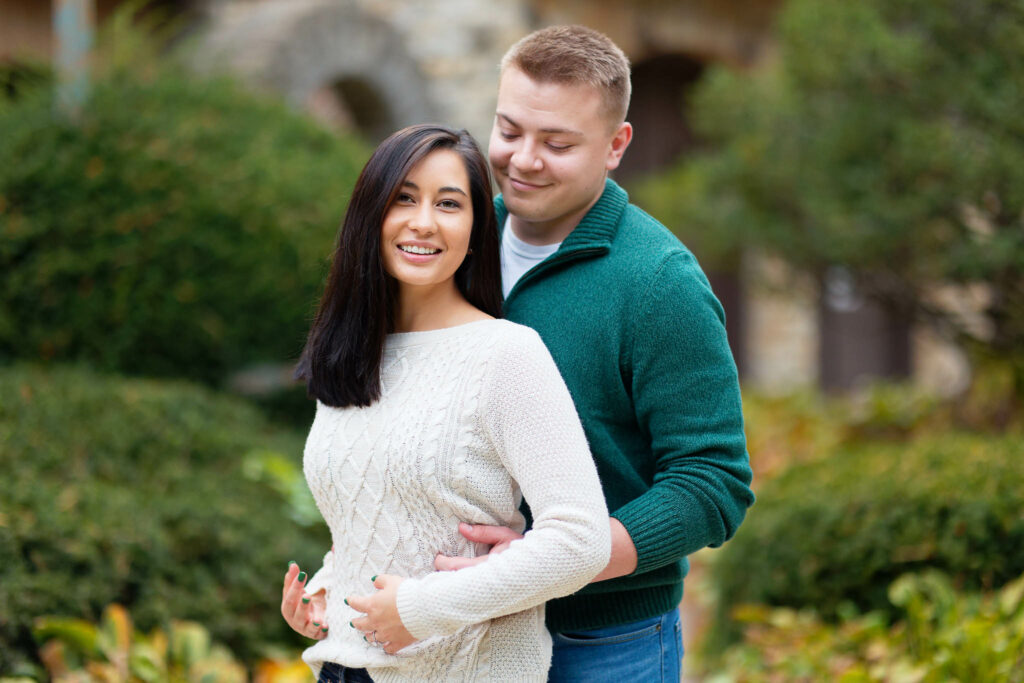 Fall Engagement session at Plummer Housewith Evergreen in the background