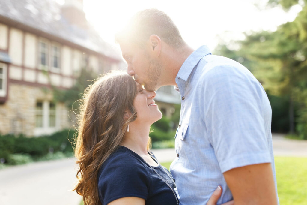 Sunset picture of a couple kissing at Plummer House