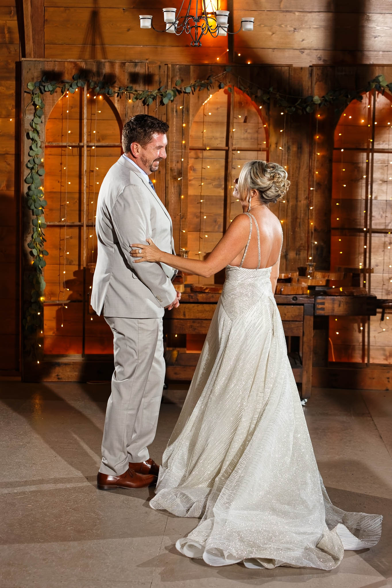 Bride and groom first look at pond view barn