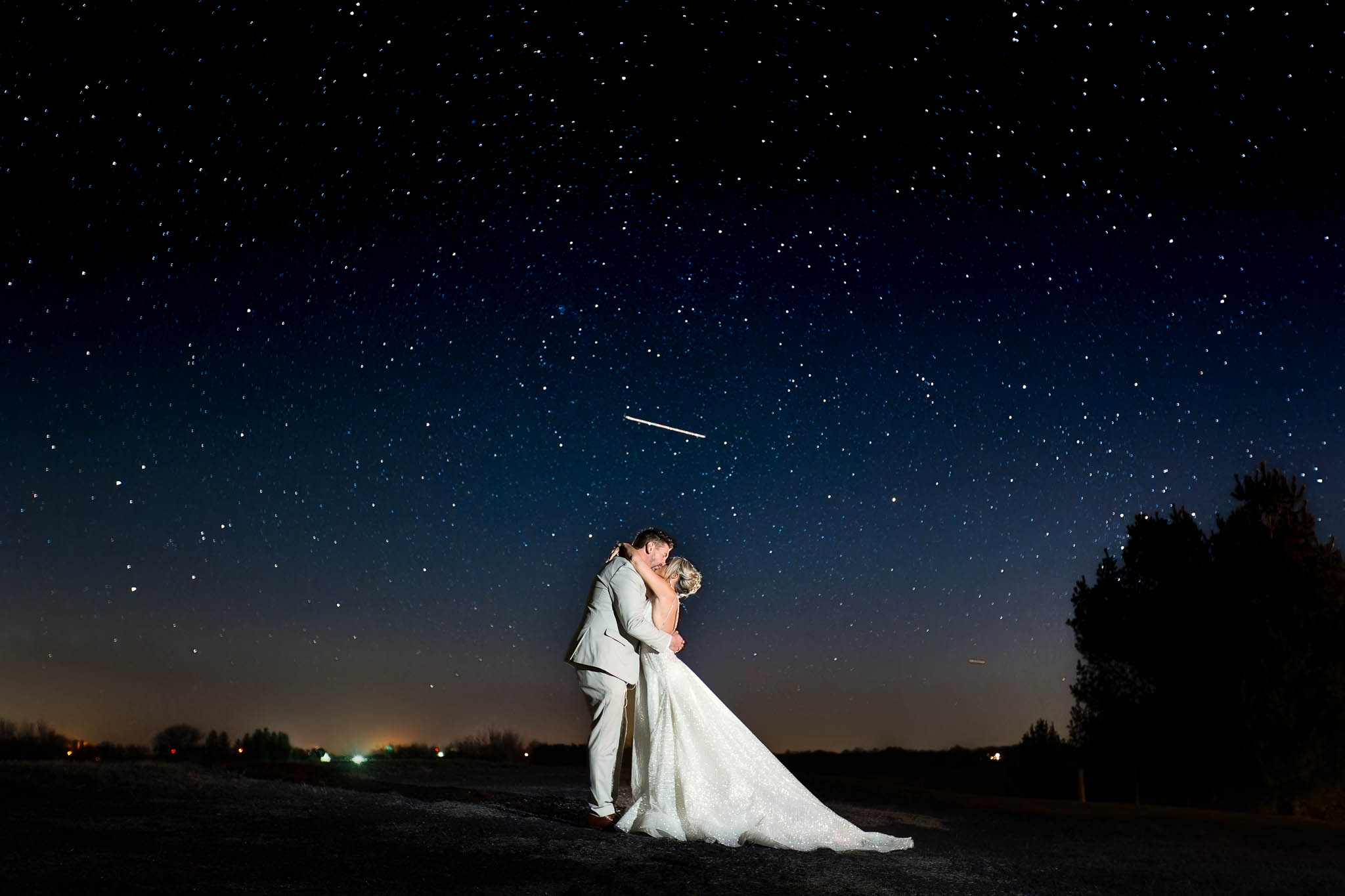 bride and groom under the stars