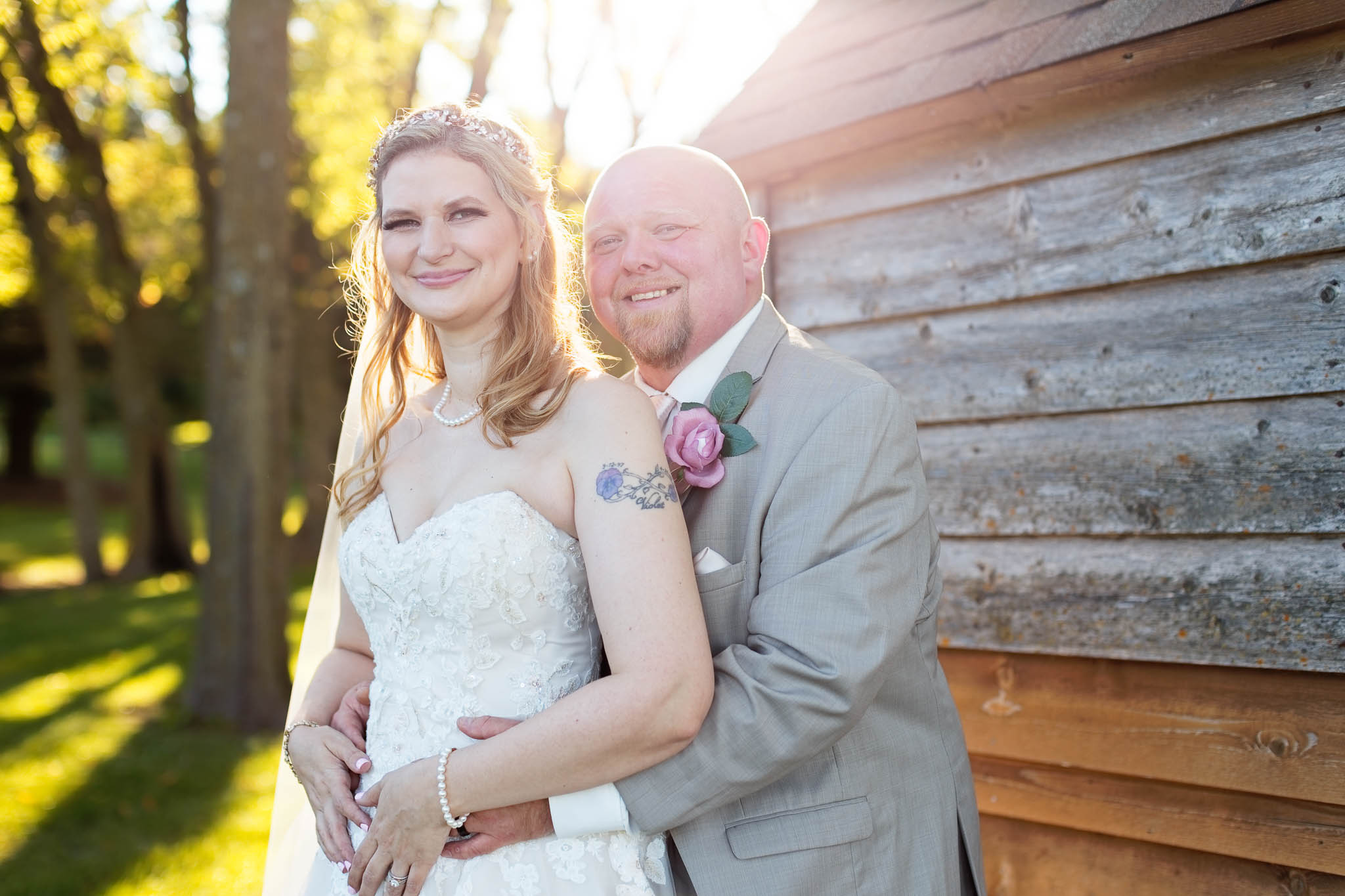 bride a groom photos pond view barn golden hour