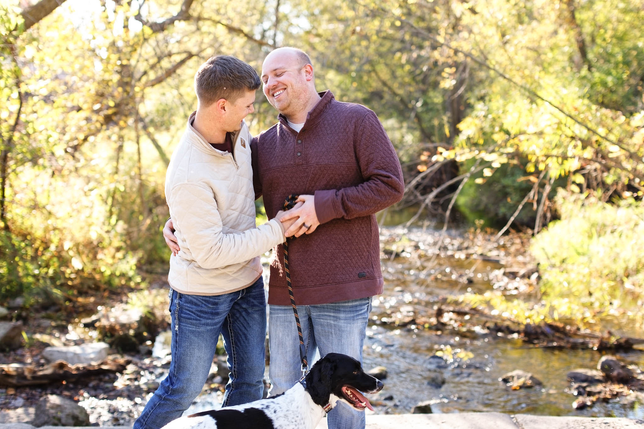 Couple in front of silver Creek at Quarry Hill Park Rochester_