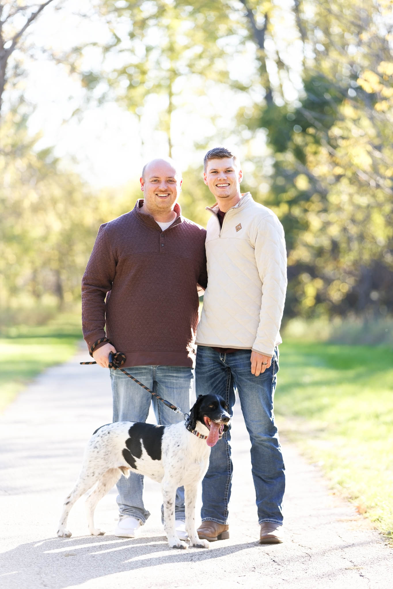 same sex couple with their dog engagement photography