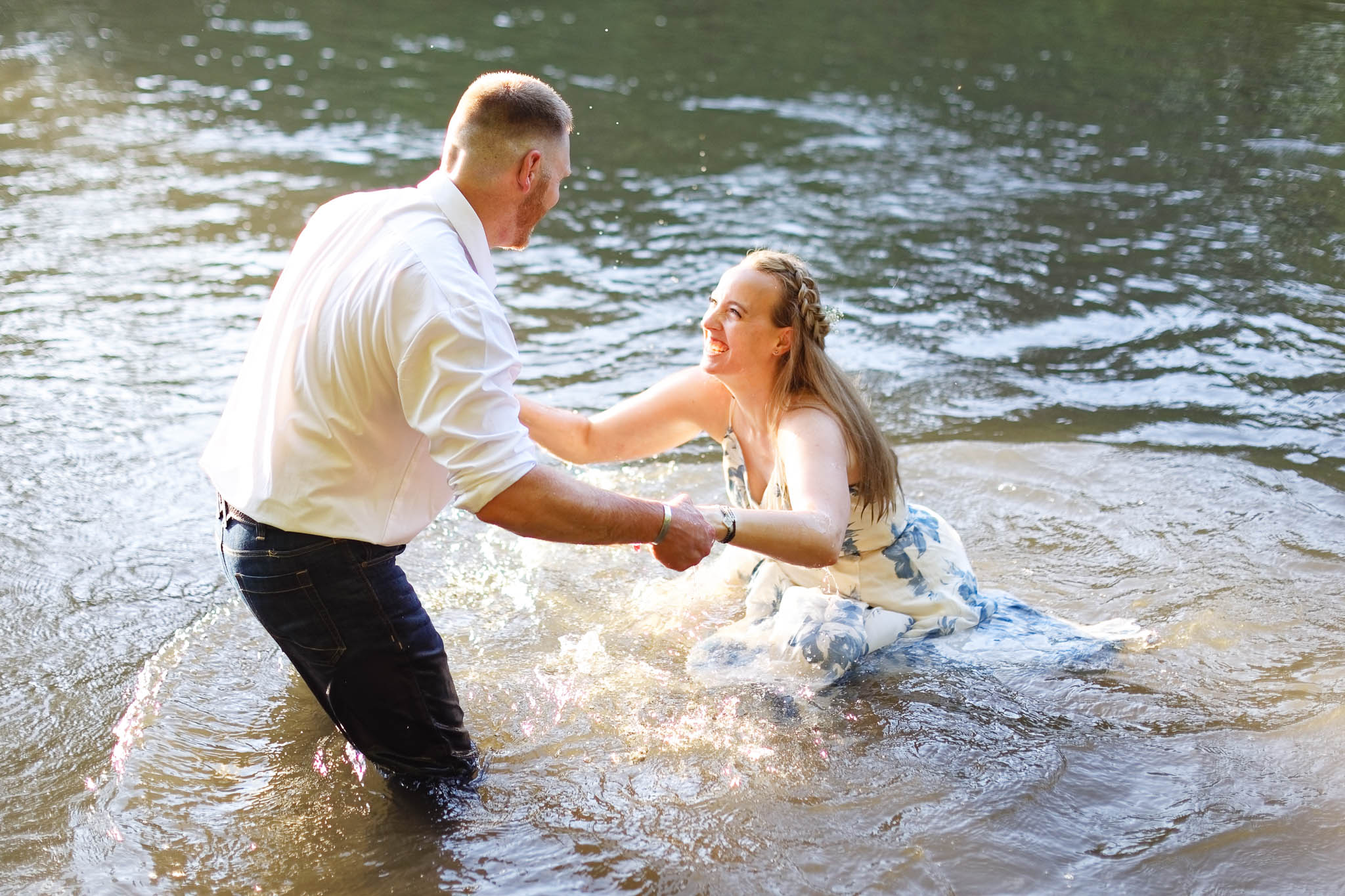 Couple playing in root river