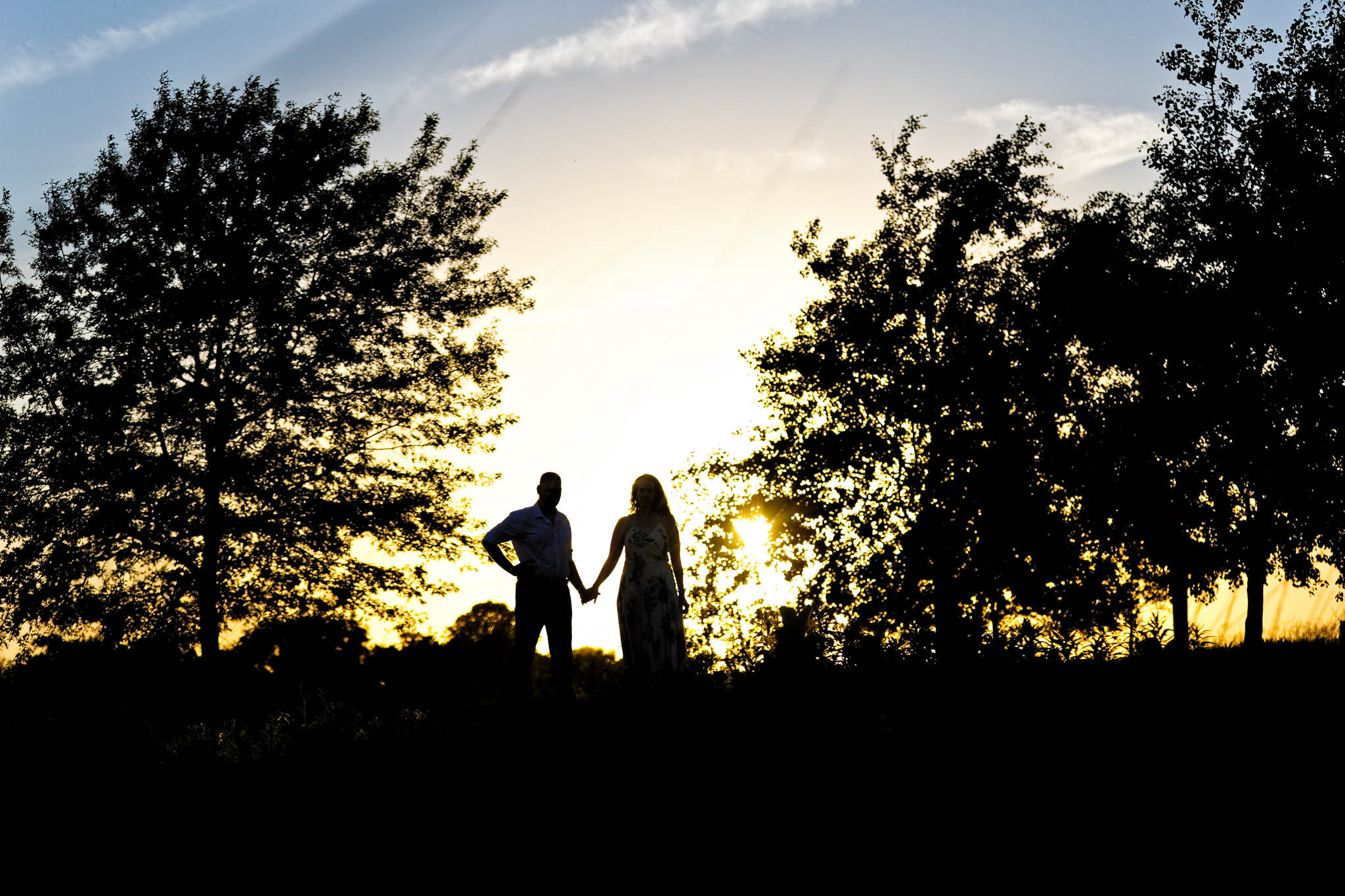 silhouette image in the meadow area sunset