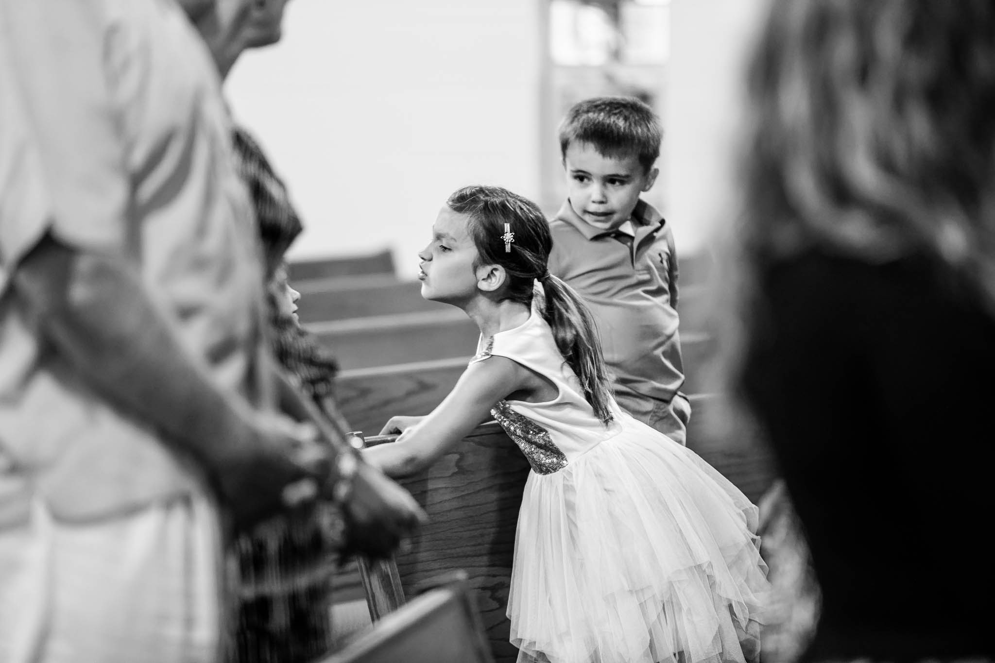 funy photos of kids Misbehaving during wedding ceremony at Saint Peter and Paul Catholic Church Mazzepa MN-2