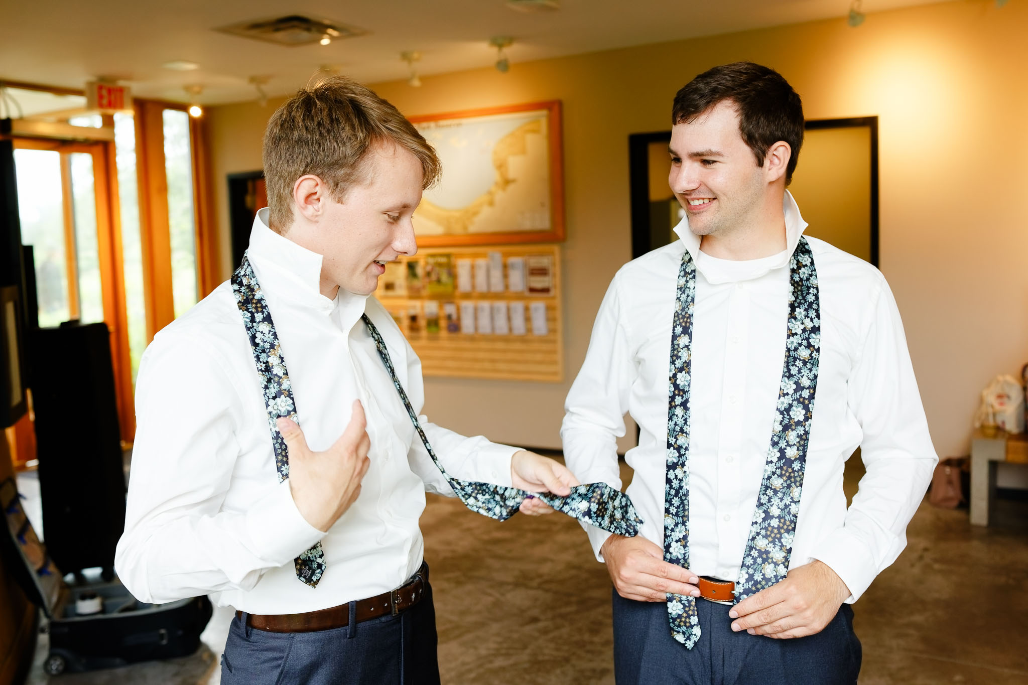 groom and groom preraration in the entrance of Schaar's Bluff Gathering Center