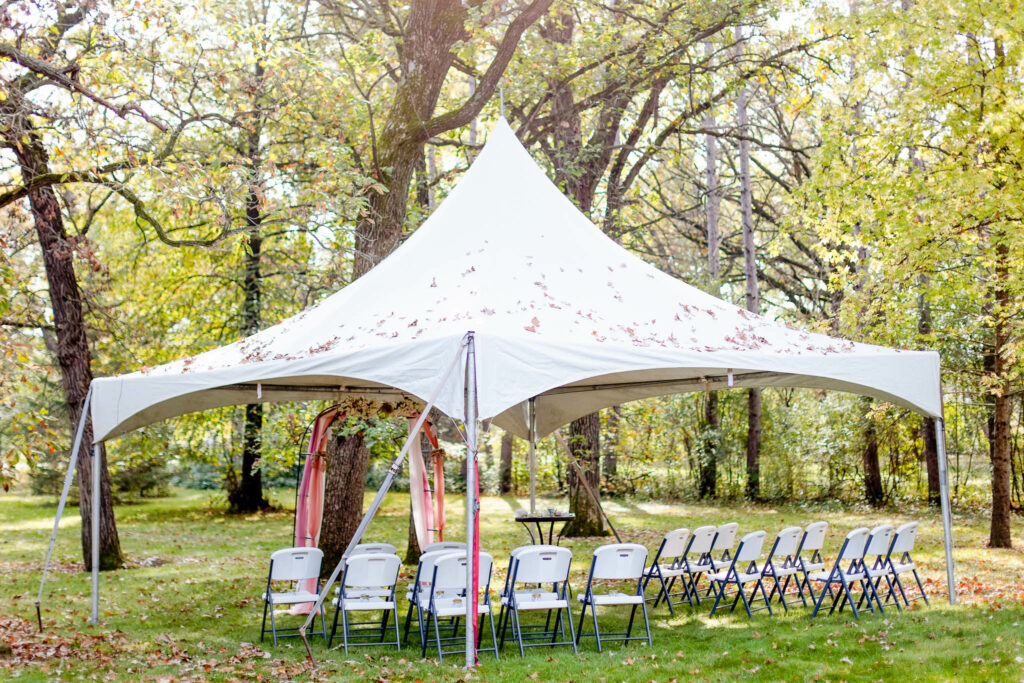 small tent in backyard for mini ceremony