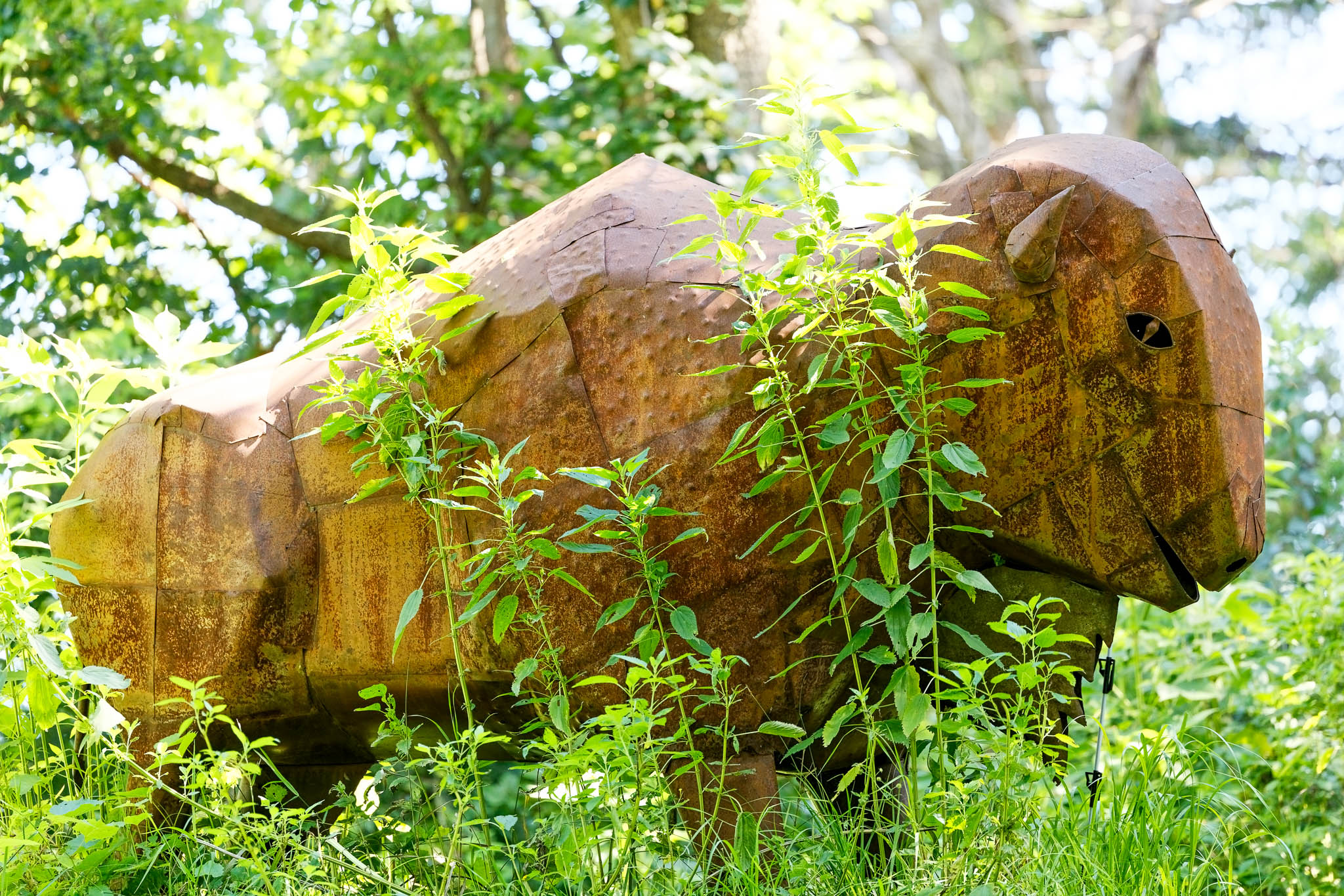 enchanted forest with sculptue