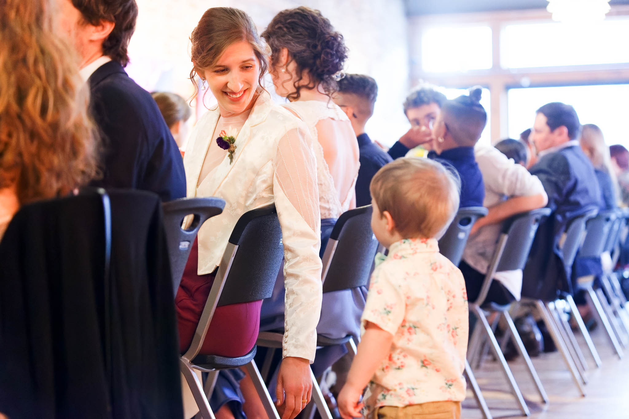candid moment where kid come to talk to the bride
