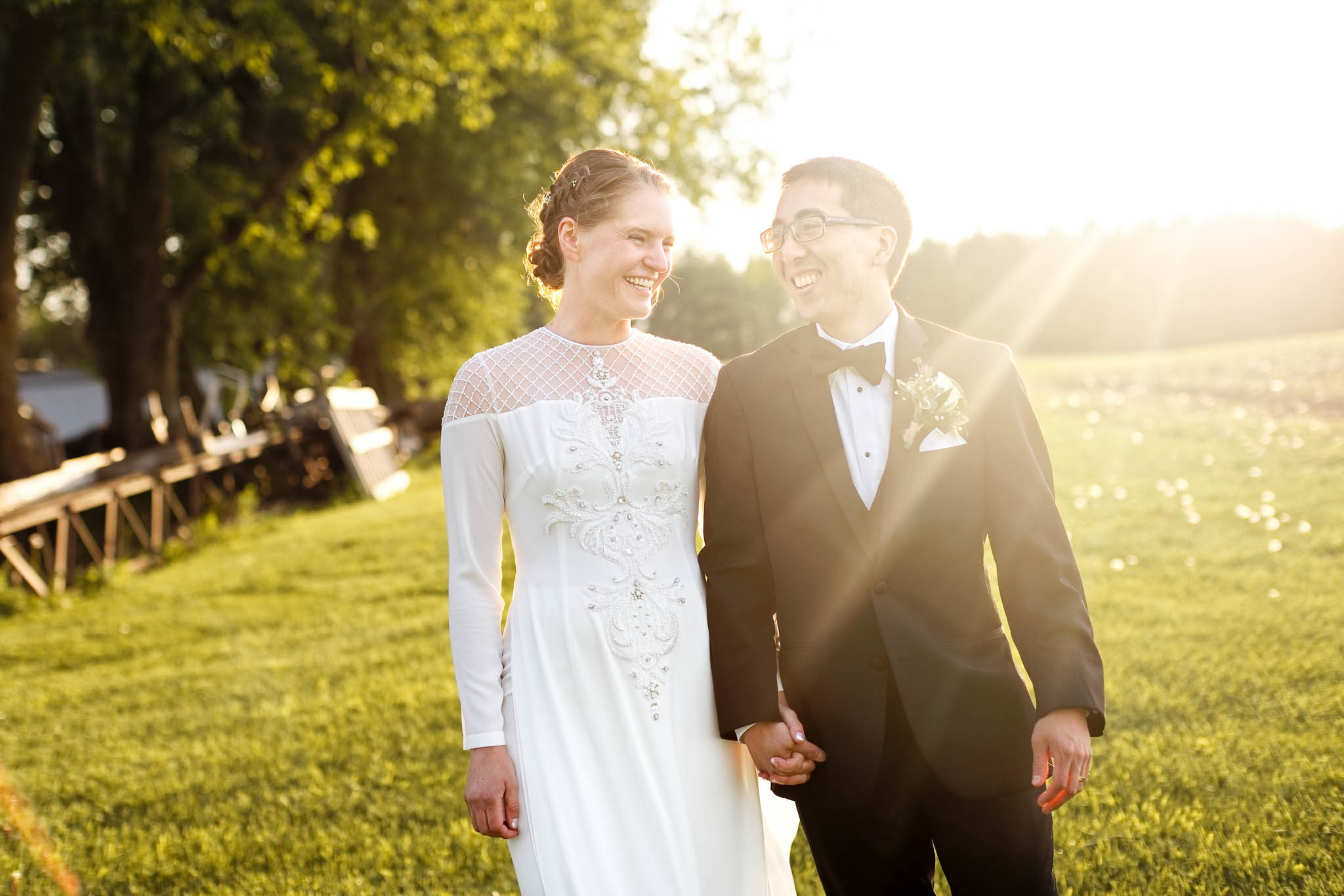 sunset photo bride and groom laughting