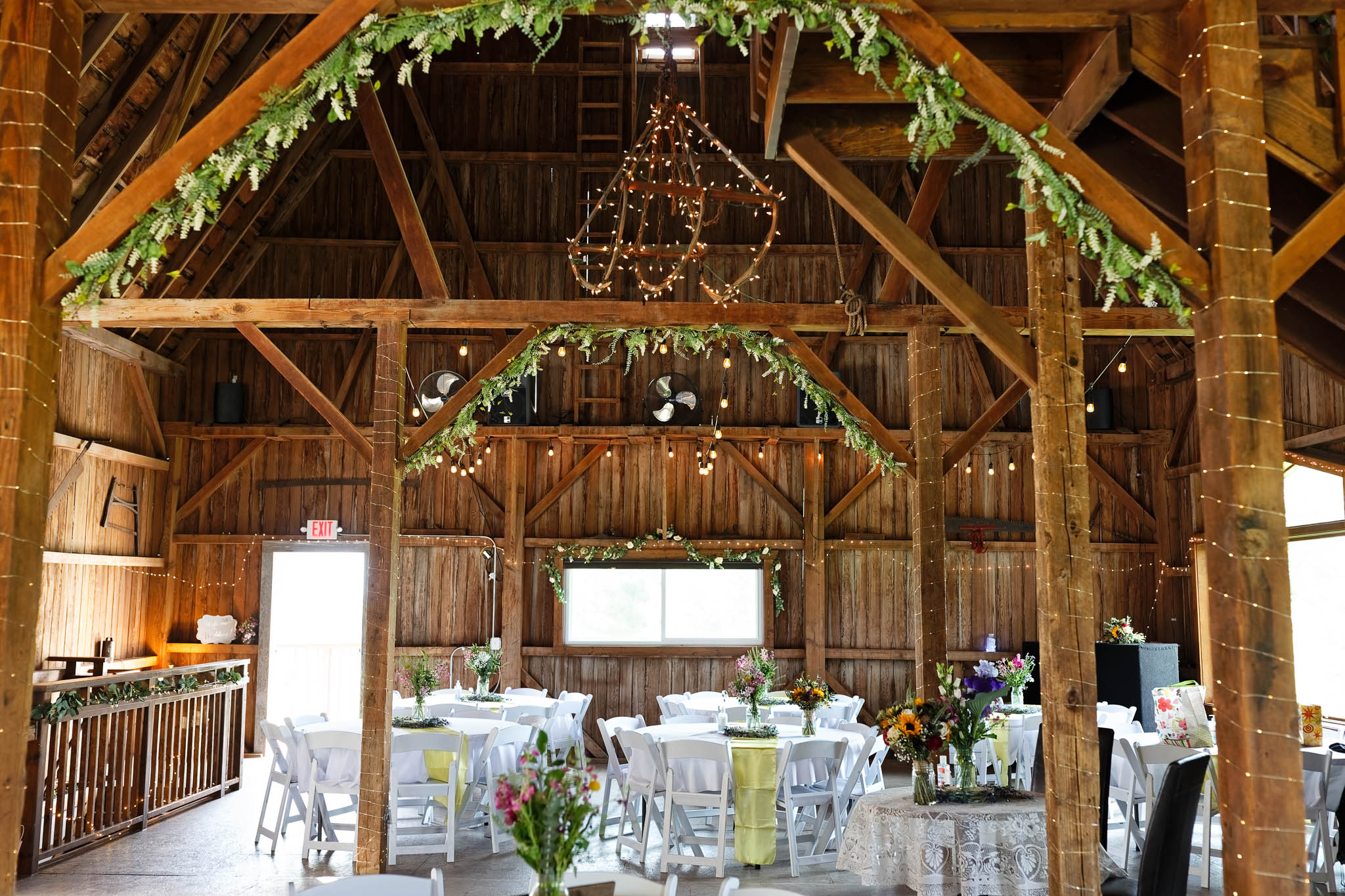 view of pond view barn set up for wedding