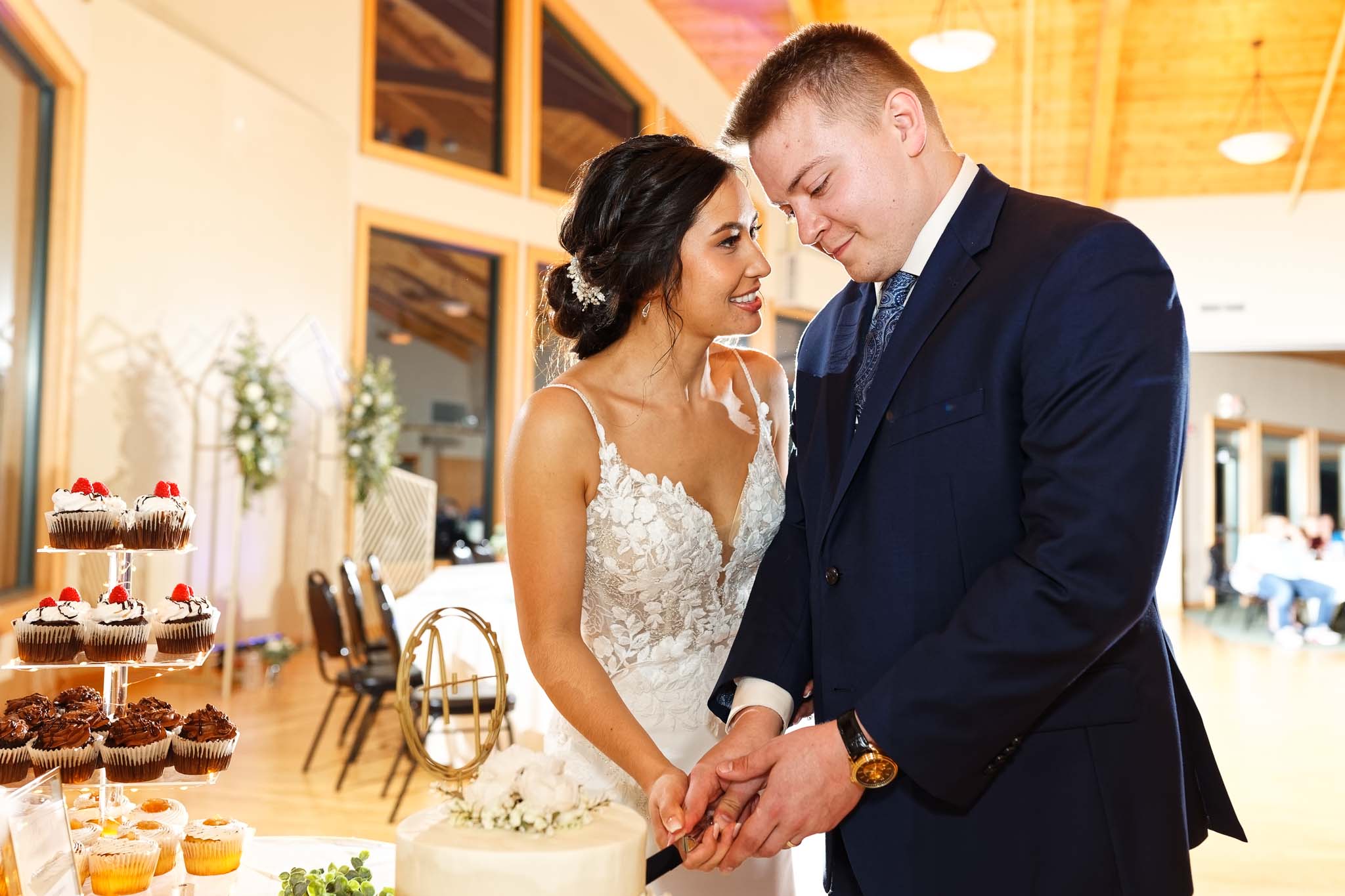 bride and groom cuting their cake