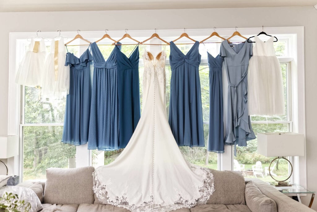 bride's dress and bridesmaids dress hanged