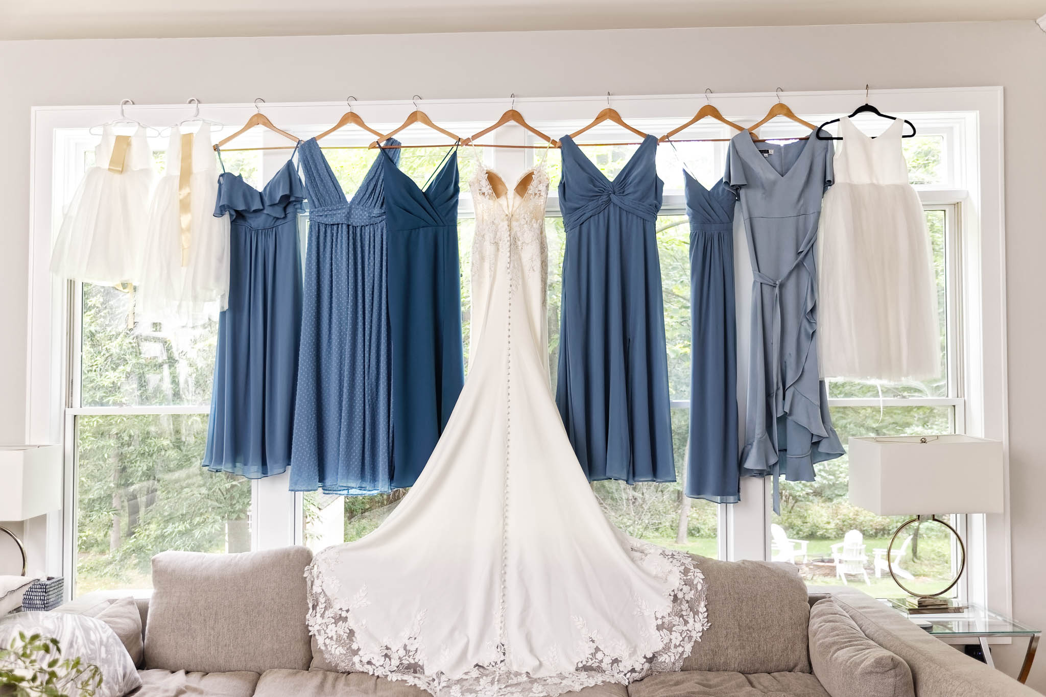 bride's dress and bridesmaids dress hanged