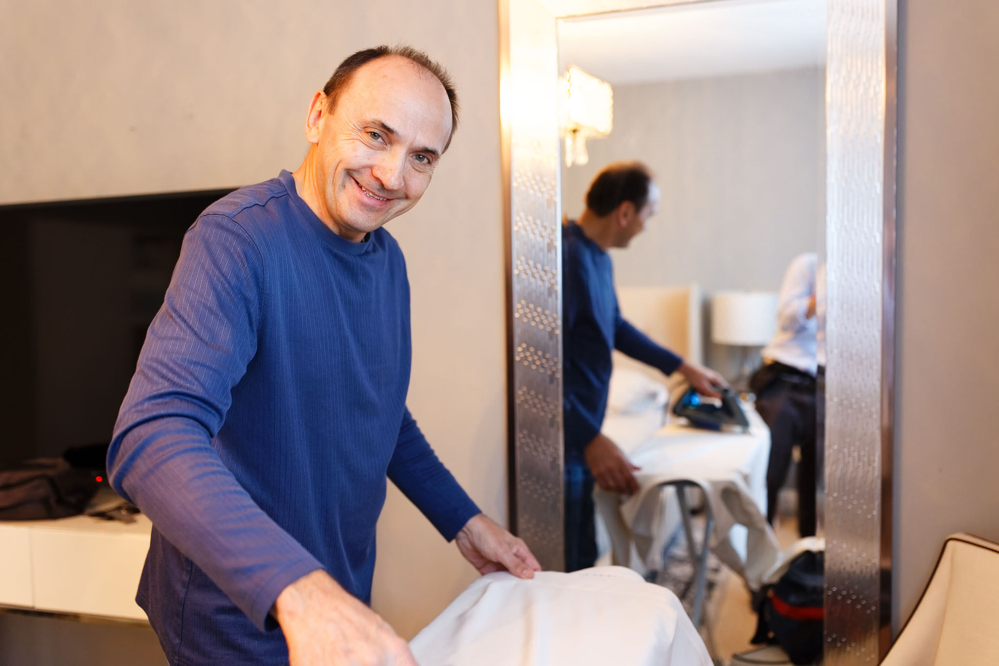 father of groom ironing