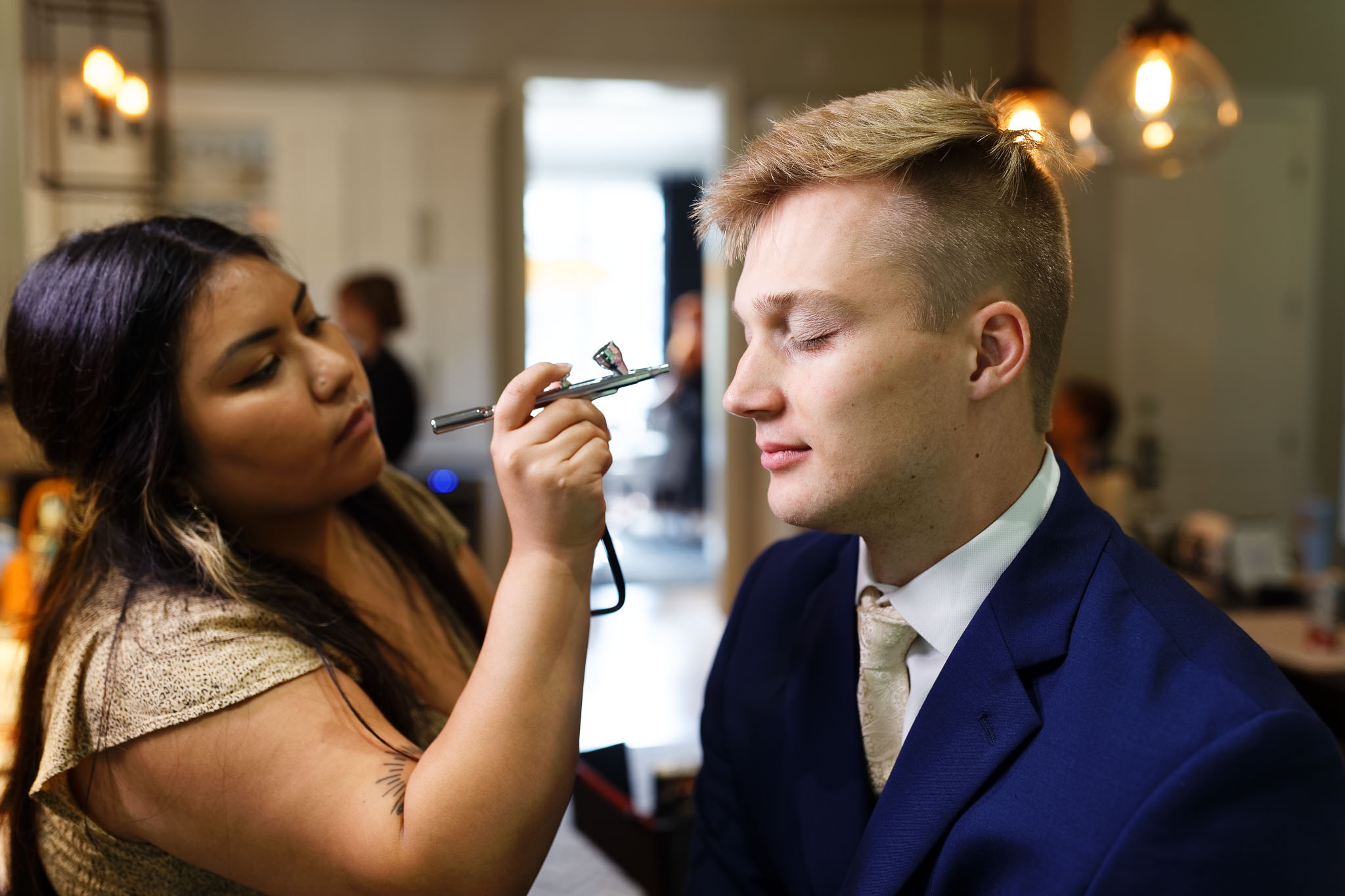groomsmen having makeup done
