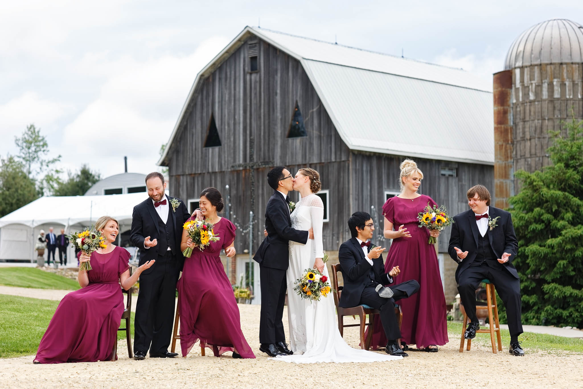 wedding party funny image with view on the barn