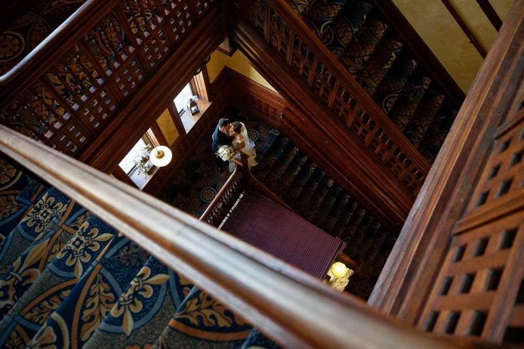 artistic composition of the bride and groom on the stairs