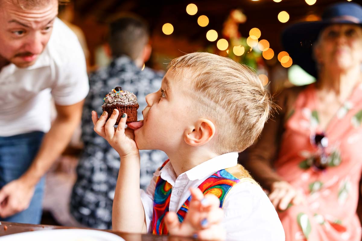 brunch wedding kid eating cake fun candid shot
