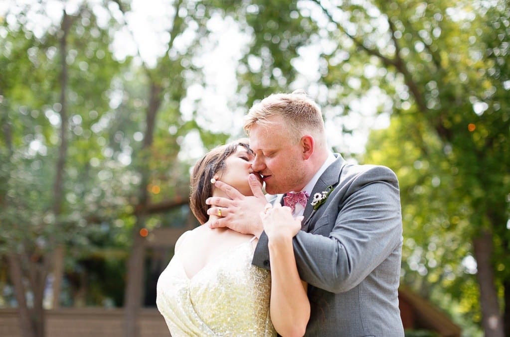 bride and groom kissing outdoor in stillwater