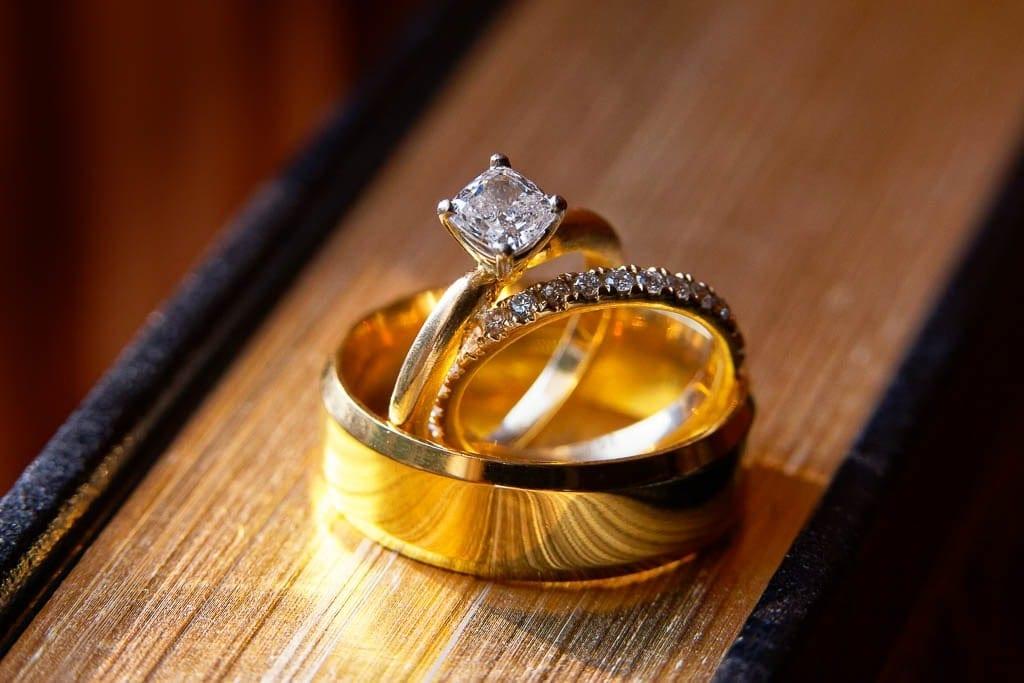 detail of wedding rings and engagement ring gold and diamond