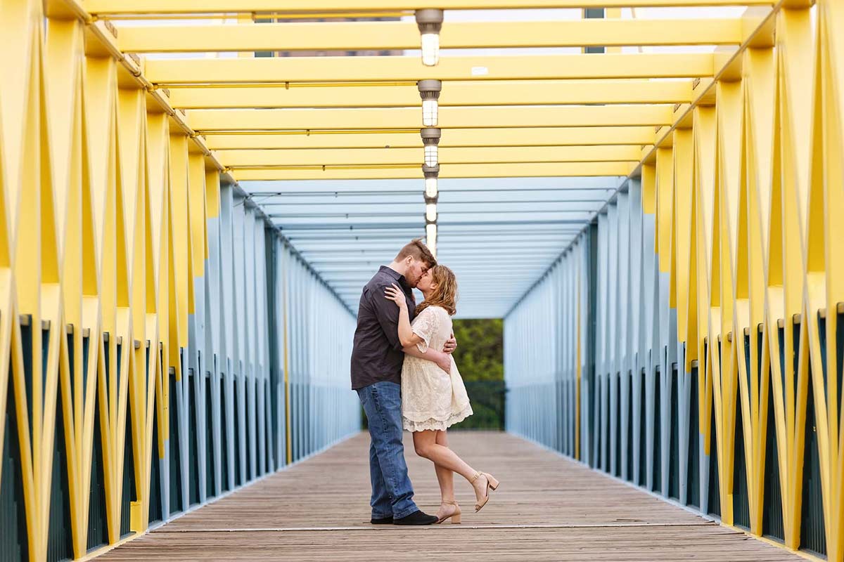 couple-kissing-on-a-bridge