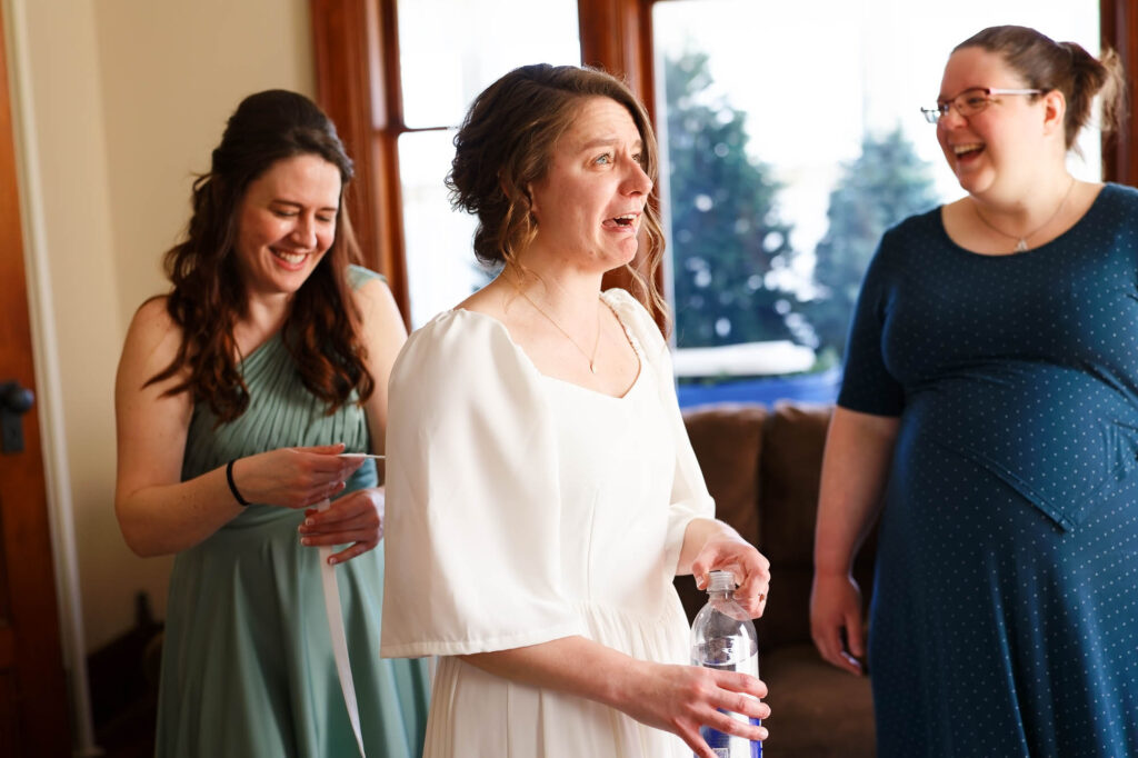 stress bride and laughing sister