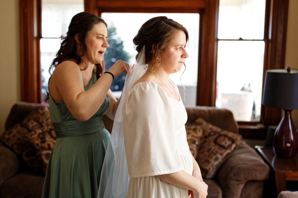 Bride sighing heavily from the stress of during their wedding.