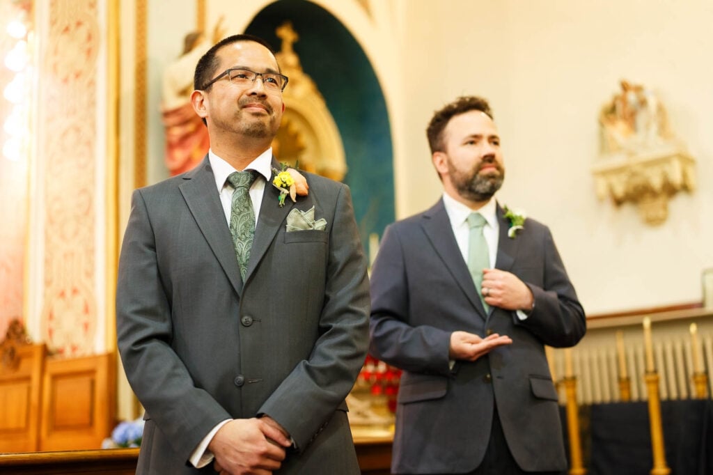Seeing his future wife enter the church on her father’s arm, the groom holds back tears