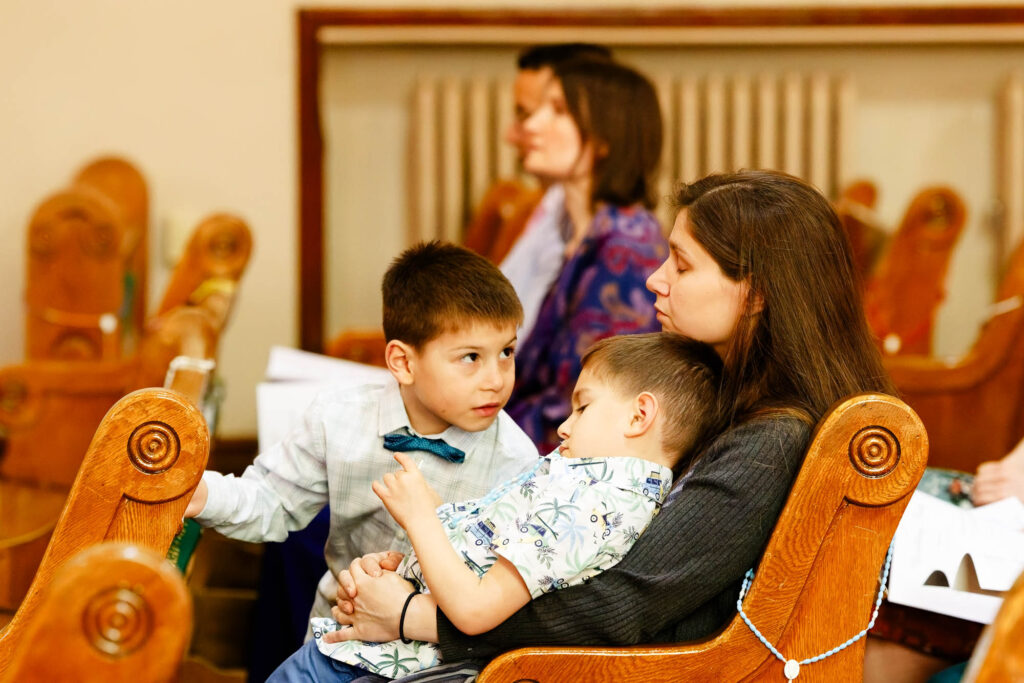 A funny moment during the Catholic wedding ceremony as two kids show clear signs of boredom
