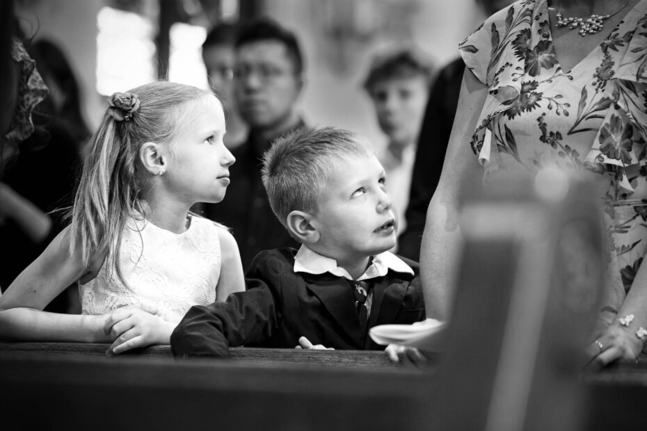Kids silly face during wedding at church