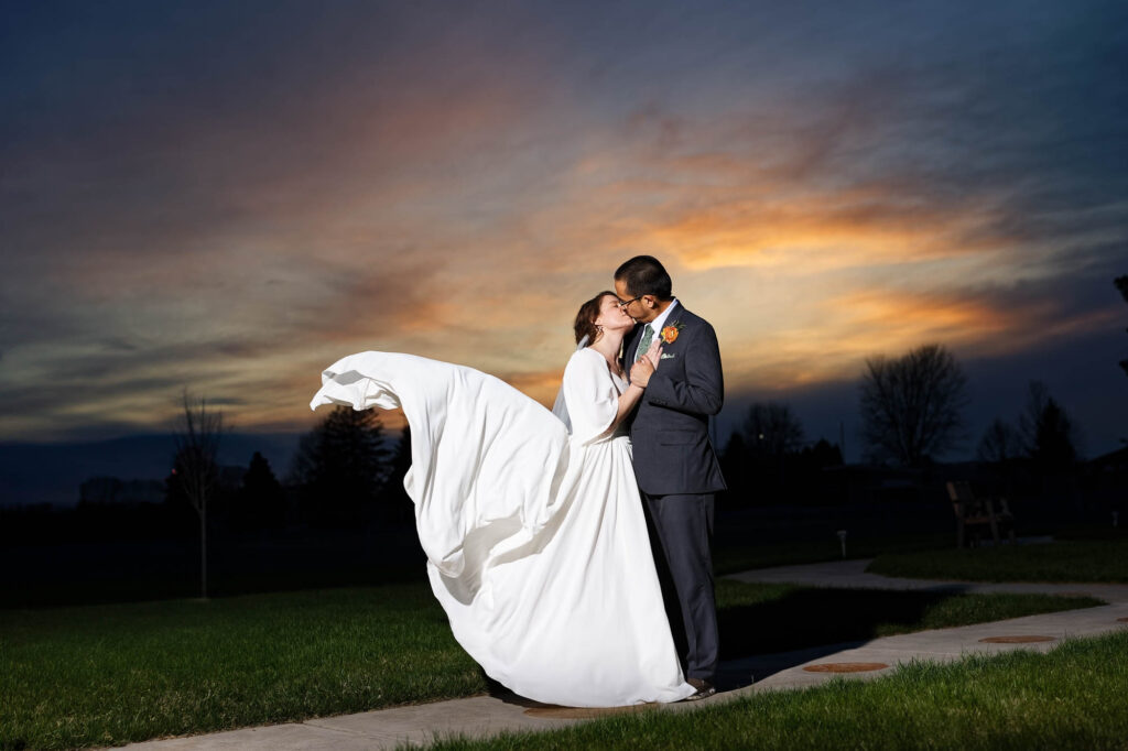 bride and groom photos with sunset