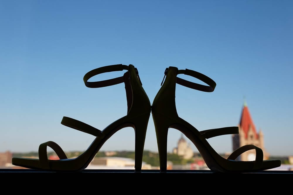 high heel shoes silhouette on blue sky