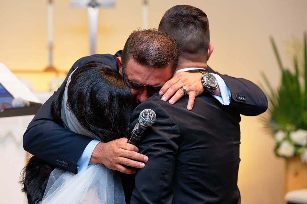 candid emotion shoot of father of the bride hugging