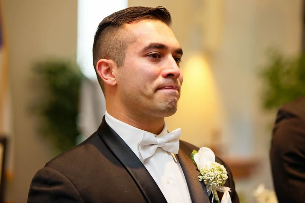 exquisite shot of groom with wet eye